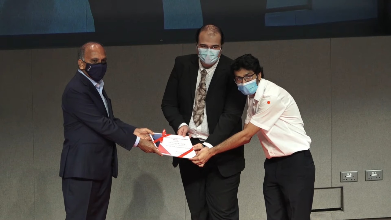 Receiving the award from NTU president Prof. Subra Suresh